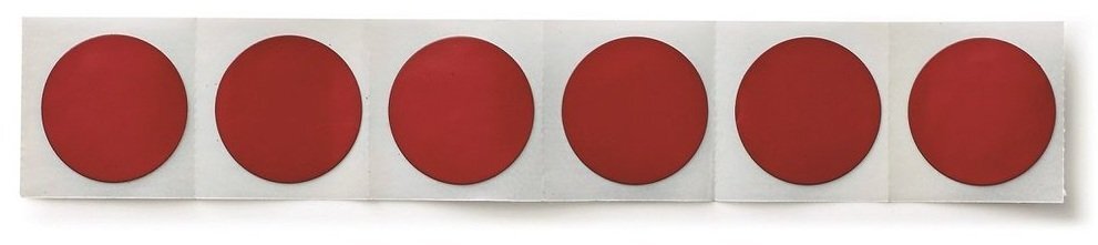 A strip of 6 self seal puncture repair patches. 