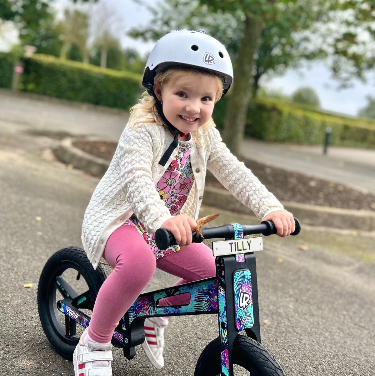 Child with a LIFERYDER VOGUE balance bike and personalised mini reg plate
