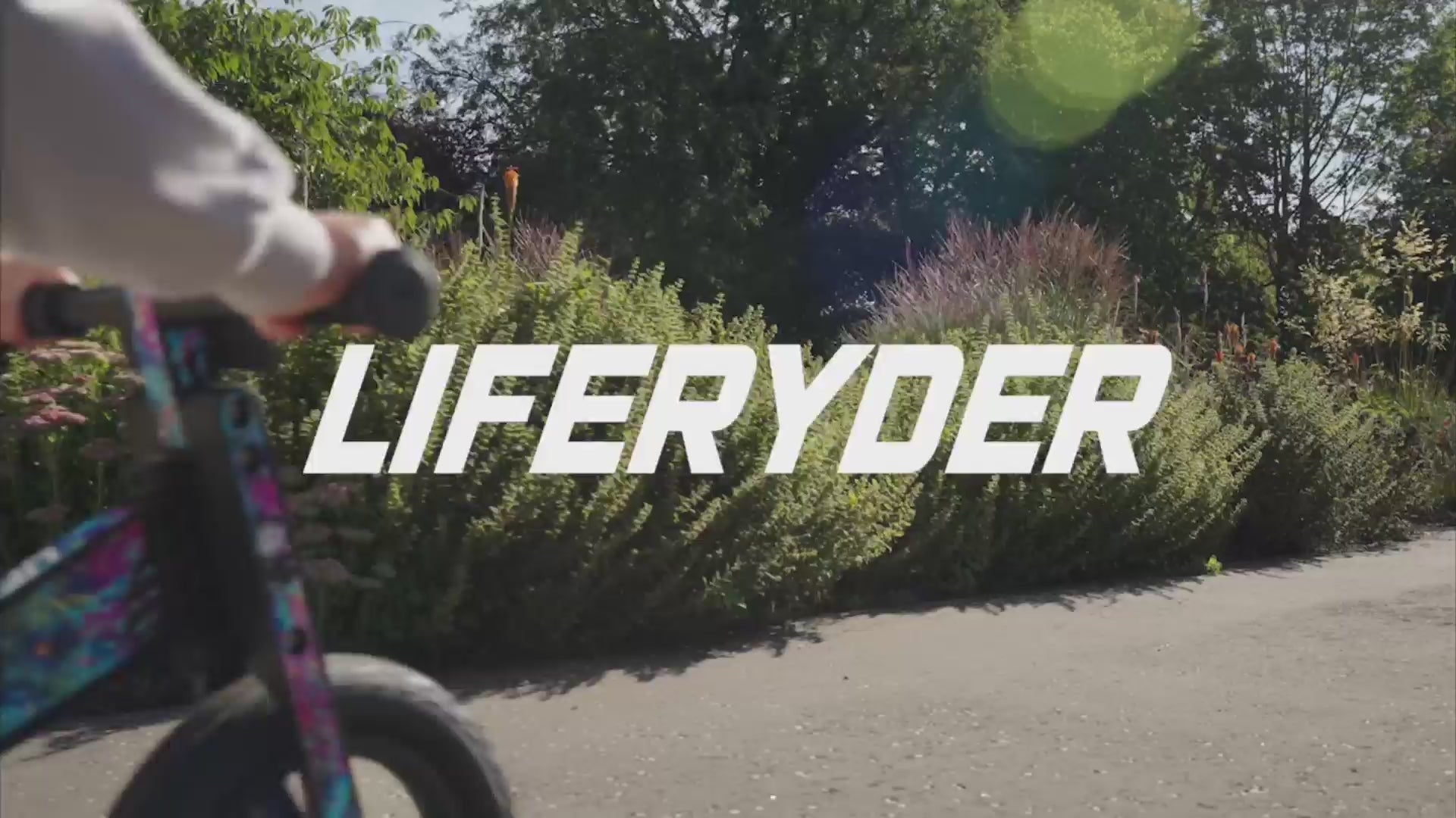 Load video: Children riding LIFERYDER kids scooters and balance bikes outdoors
