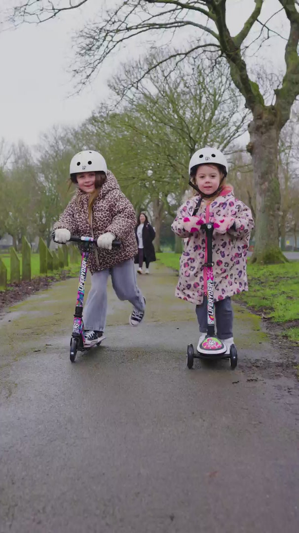 Load video: Children riding LIFERYDER HALO and QUEST scooters outdoors